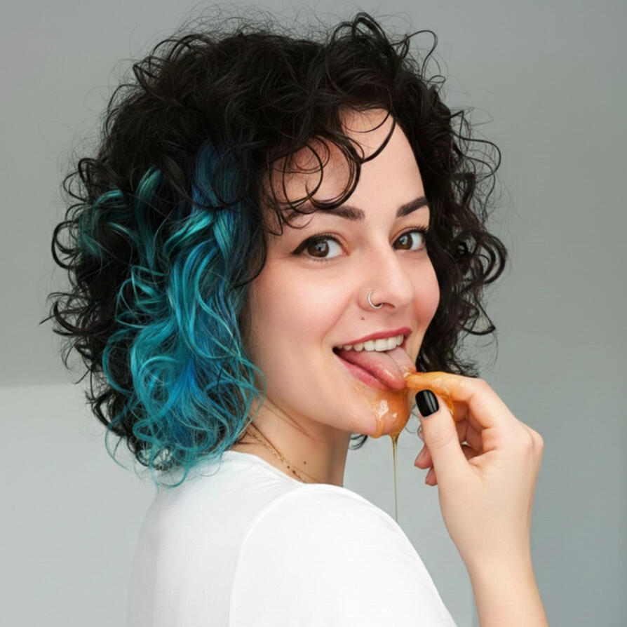 Meet Anni Eza Anni Eza co-founder and facilitator of Seeds of Bliss, image of her leaking honey
