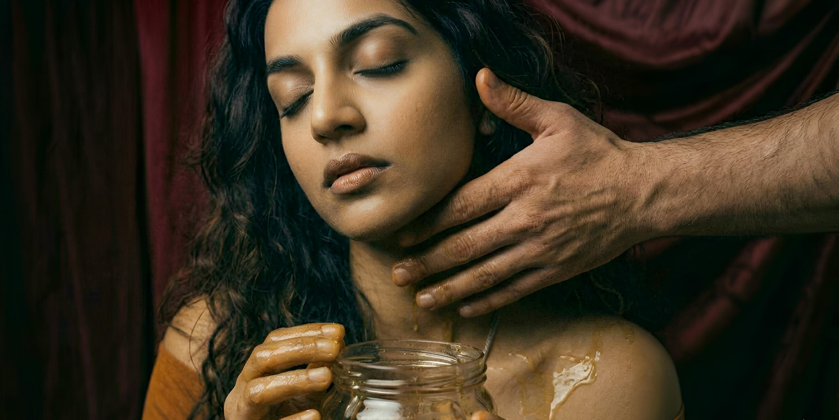 A woman over 40 being honeyed by a masculine man's hand A woman over 40 being honeyed by a masculine man's hand as an act of devotion to bring more of her sweetness